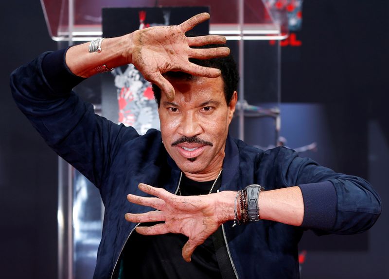 FILE PHOTO: Recording artist Richie shows his hands after placing