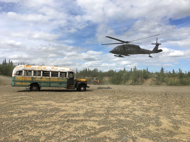 Alaska Army National Guard helicopter hovers near “Bus 142” near