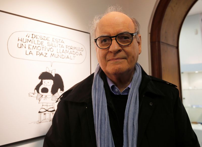 FILE PHOTO: Argentine cartoonist Quino poses in front of his