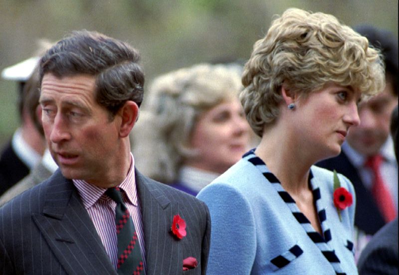 FILE PHOTO: Princess Diana and Prince Charles look in different