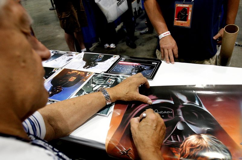 FILE PHOTO: David Prowse, who portrayed Darth Vader, signs autographs