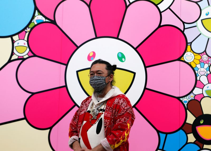 Japanese artist Takashi Murakami speaks to reporters in Tokyo