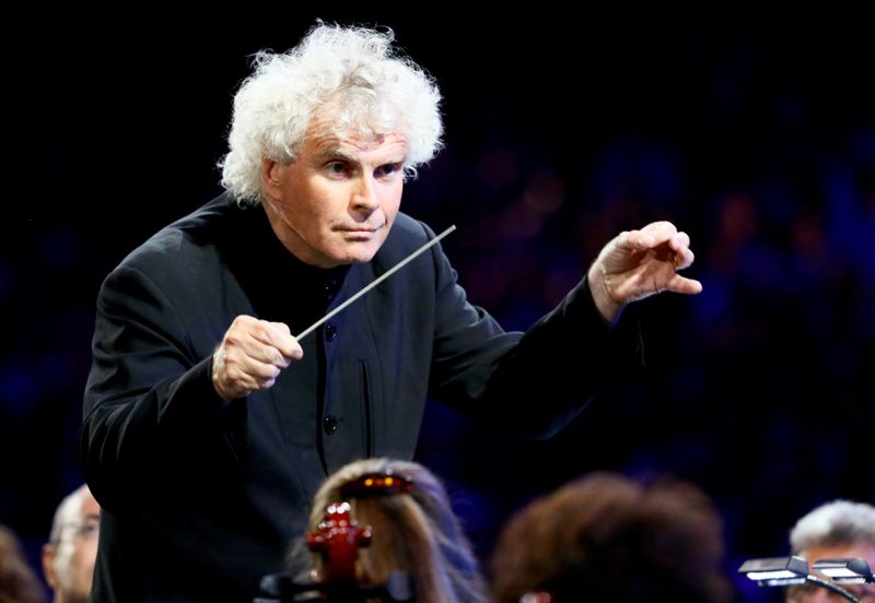 FILE PHOTO: Conductor Simon Rattle takes part in the opening