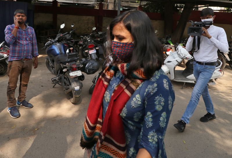 Aparna Purohit arrives for questioning at a police station in