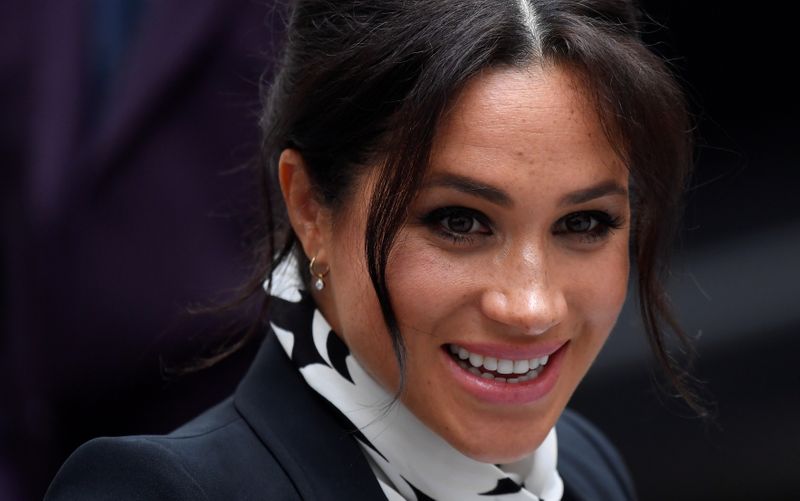 Britain’s Meghan, Duchess of Sussex, leaves after an International Women’s