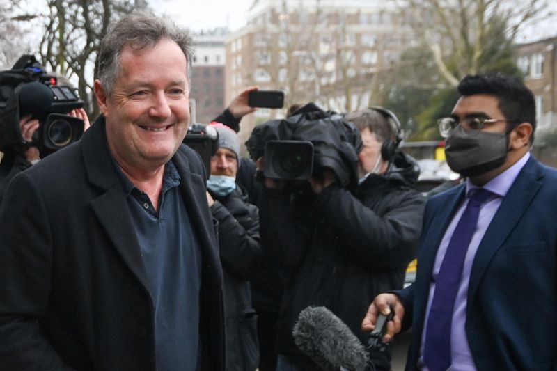 Piers Morgan walks with his daughter Elise in London