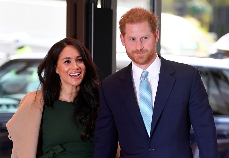 Britain’s Prince Harry and Meghan, Duchess of Sussex, attend the