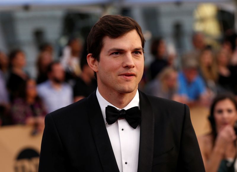 FILE PHOTO: Actor Ashton Kutcher arrives at the 23rd Screen