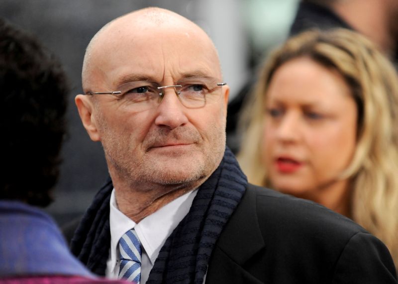 FILE PHOTO: British musician Phil Collins watches his daughter British