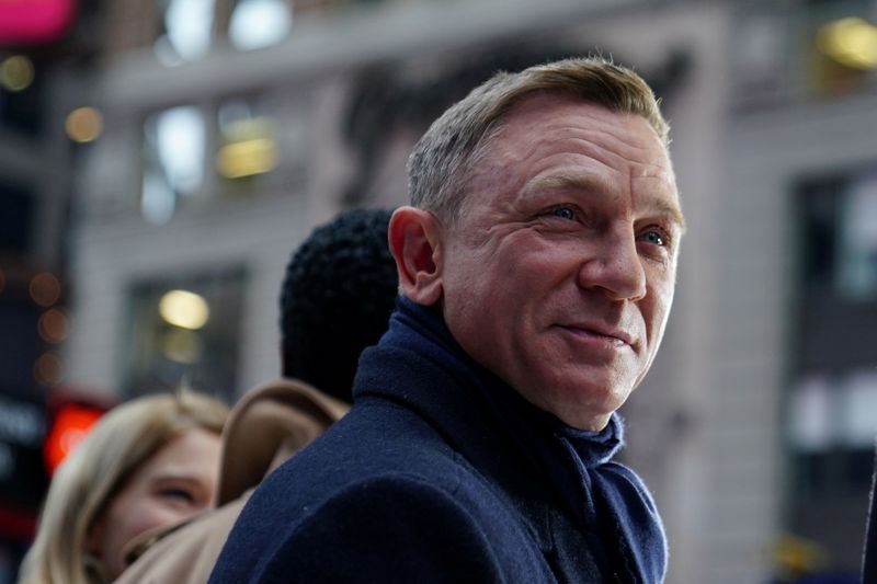 FILE PHOTO: Actor Daniel Craig reacts during a promotional appearance