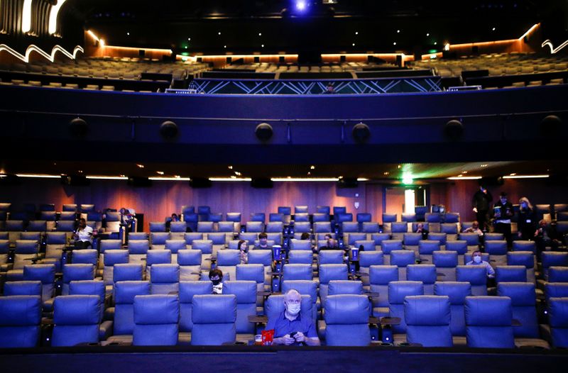 FILE PHOTO: People take their seats inside the Odeon Luxe