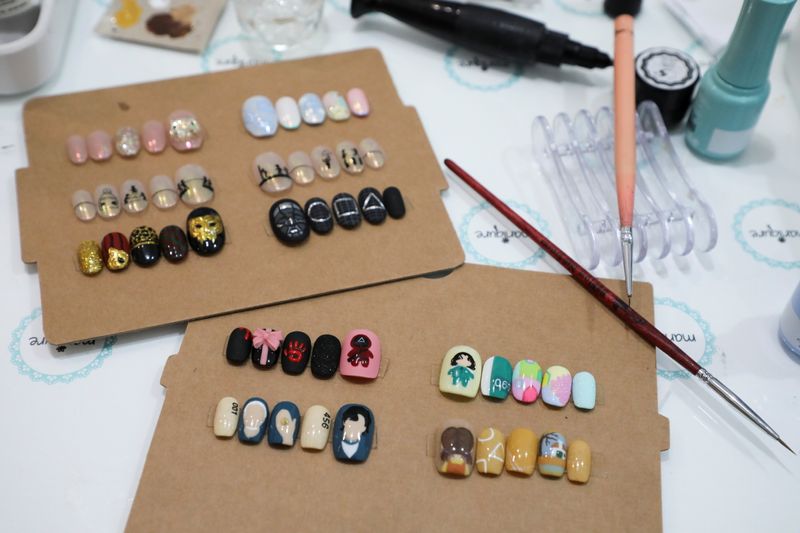 Samples of Squid Game’s manicure are displayed at the nail