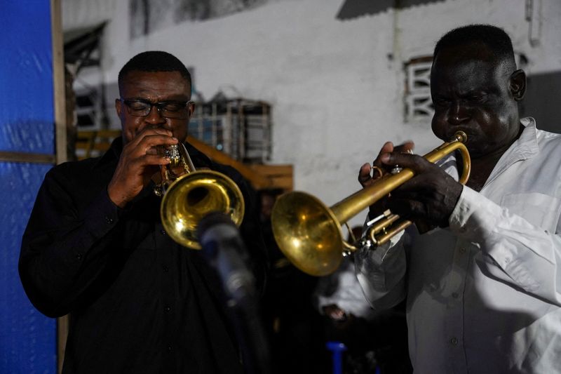 FILE PHOTO: Trumpeters from the Bana OK band play at