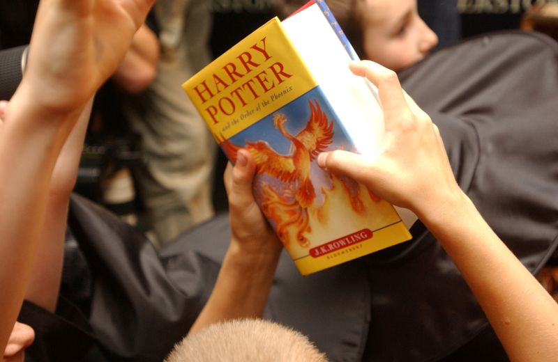 FILE PHOTO: A child holds the latest “Harry Potter” book