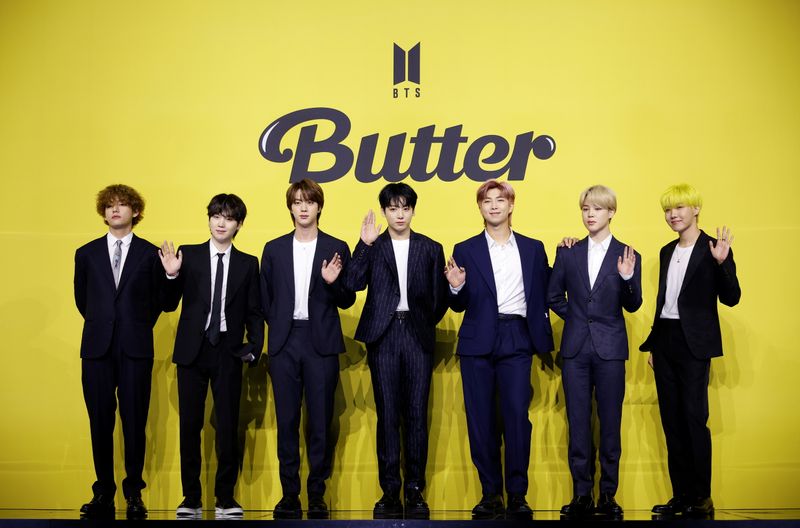 Members of K-pop boy band BTS pose for photographs during