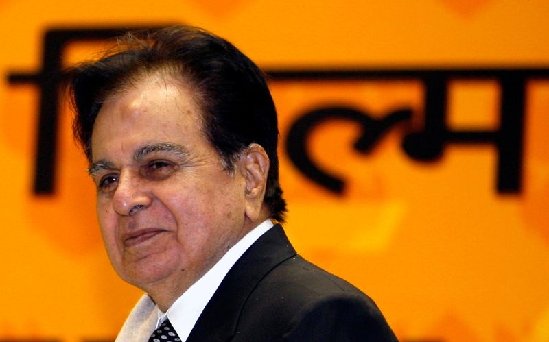 FILE PHOTO: Bollywood star Dilip Kumar smiles after receiving an