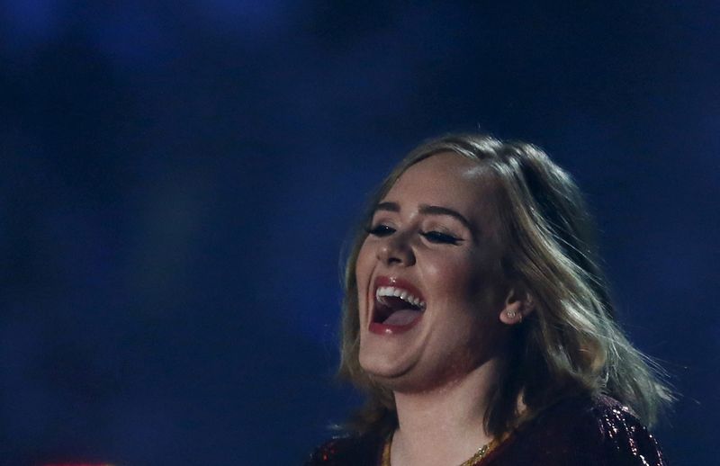FILE PHOTO: British singer Adele receives her award for British