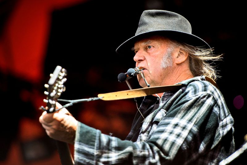 FILE PHOTO: Neil Young takes aim at Spotify CEO, big