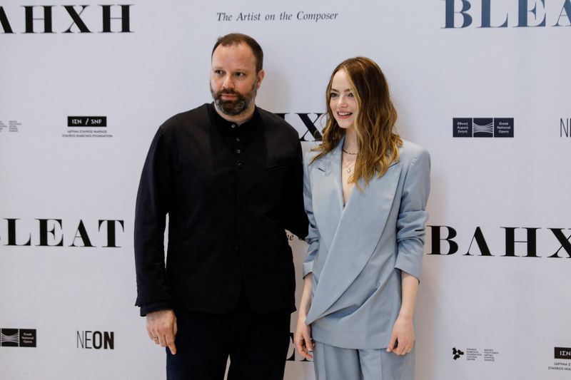 Director Yorgos Lanthimos and actress Emma Stone pose for a