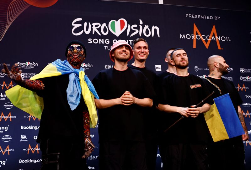 Kalush Orchestra from Ukraine pose for photographers after winning the