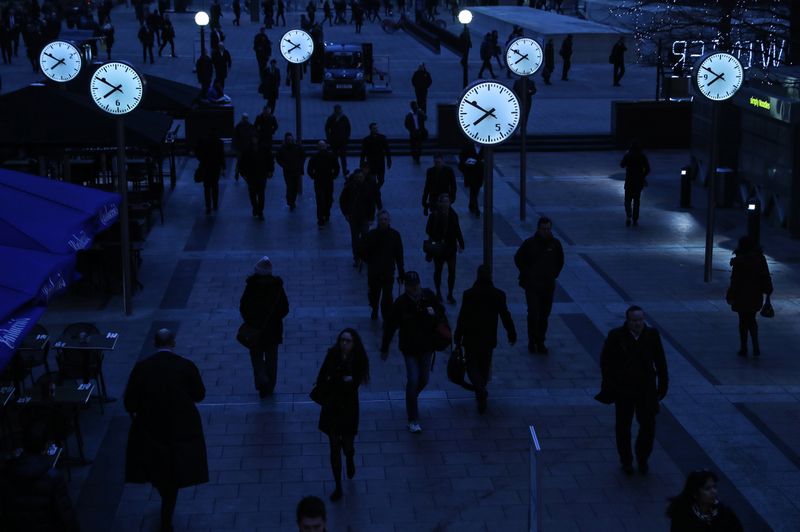 Workers walk to work during the morning rush hour in