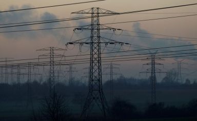 FILE PHOTO: Smog is seen near transmission towers in Bedzin