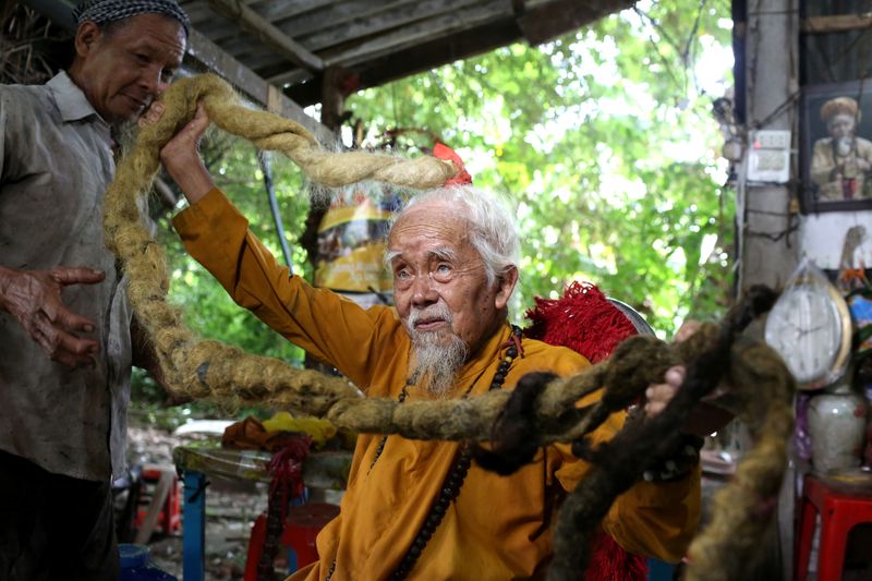 A 92-year-old man shows his five-meter long hair in Vietnam