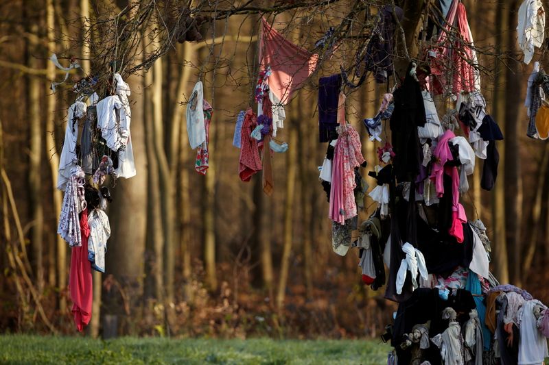 Masks hang on trees in northern France to banish COVID-19