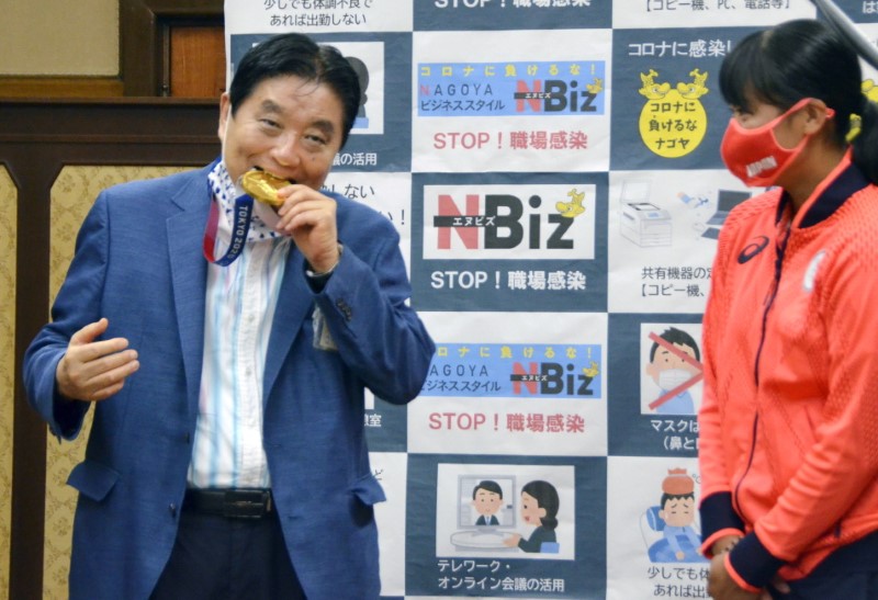 FILE PHOTO: Nagoya city Mayor Takashi Kawamura bites the Tokyo