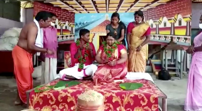 Indian couple float to wedding venue in cooking vessel amid