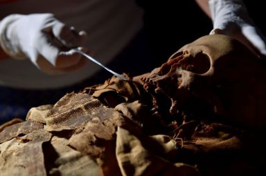 An Egyptian mummy is transferred from the Civic Archaeological Museum