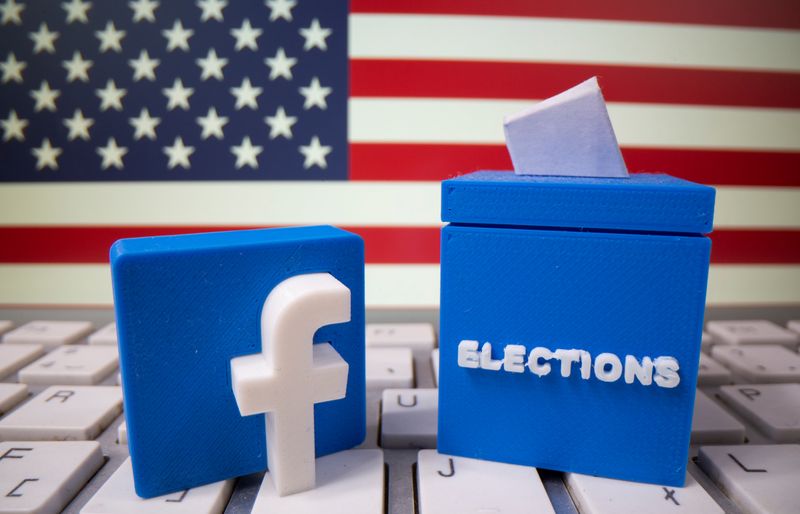 A 3D printed elections box and Facebook logo are placed