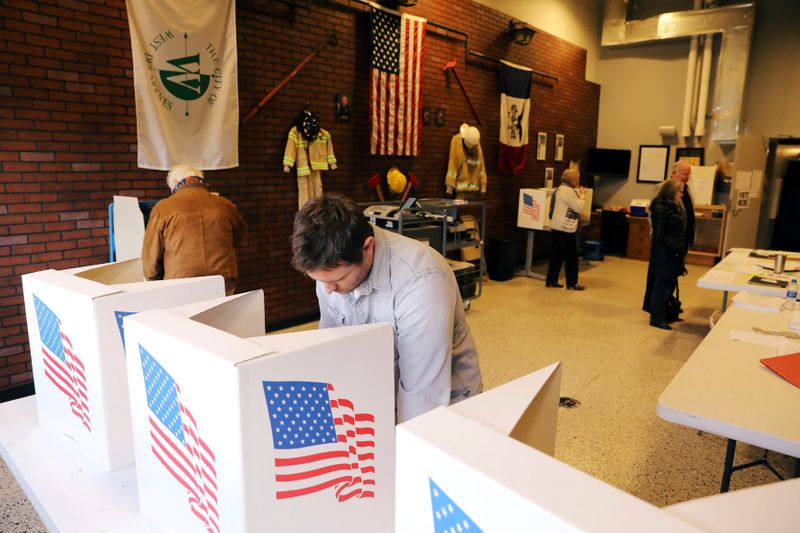 Voters cast ballots for the midterm elections at a polling
