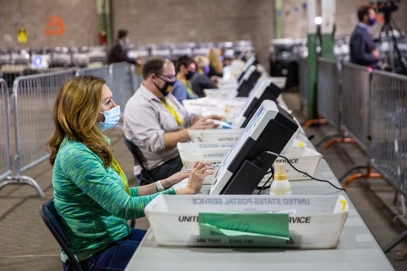 Poll workers tabulate ballots at the Allegheny County Election Warehouse