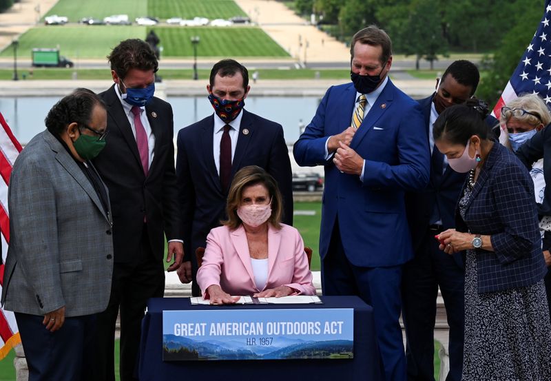 U.S. House Speaker Nancy Pelosi hosts a bill enrollment ceremony