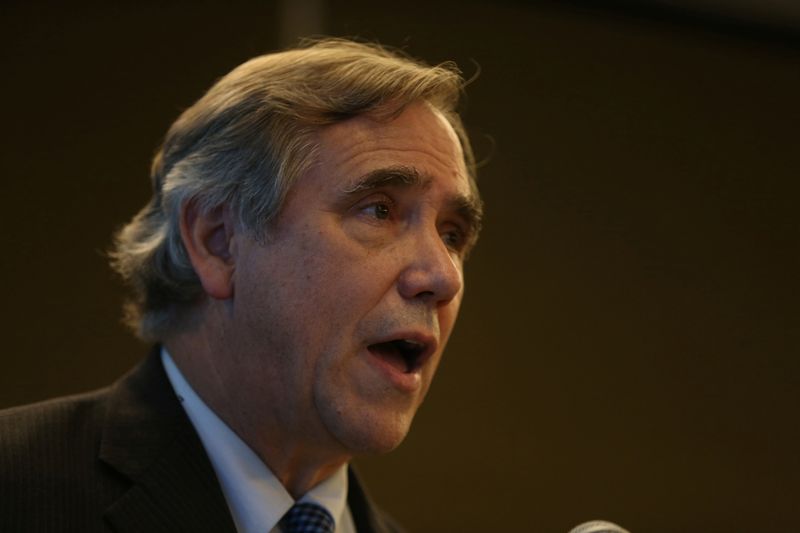 Senator Jeff Merkley talks to reporters during a news conference