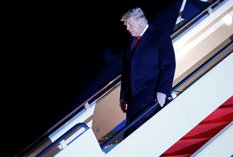 FILE PHOTO: U.S. President Donald Trump disembarks from Air Force