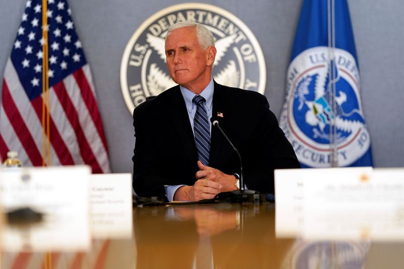 FILE PHOTO: Vice President Mike Pence listens during a briefing