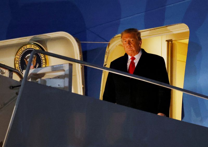 FILE PHOTO: U.S. President Donald Trump disembarks from Air Force