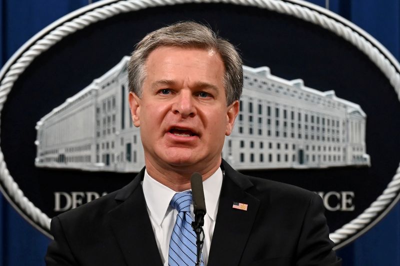 FILE PHOTO: FBI Director Christopher Wray speaks during a press