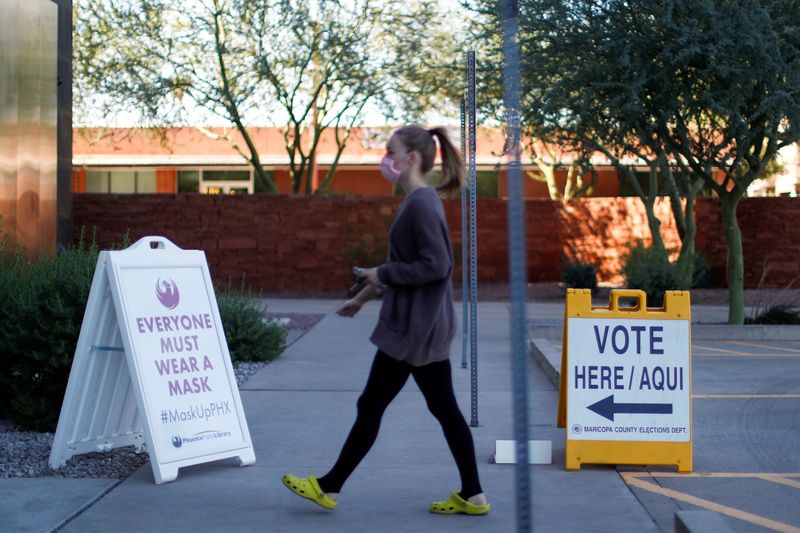 FILE PHOTO: A woman walks to cast her ballot at