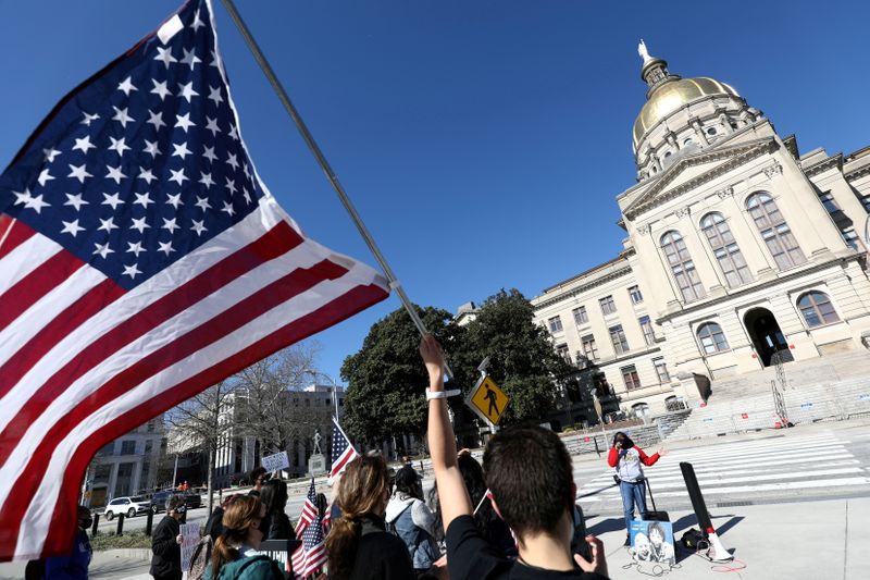FILE PHOTO: Protesters rally against voting restrictions in U.S. state
