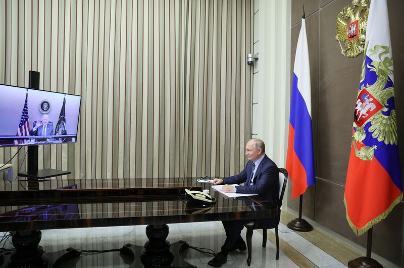 Russian President Vladimir Putin holds talks with U.S. President Joe