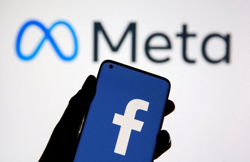 FILE PHOTO: A smartphone with Facebook’s logo is seen in