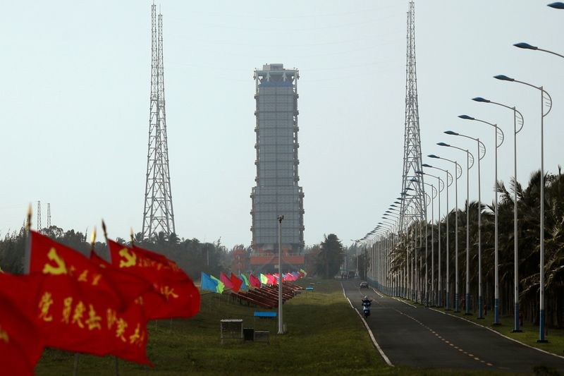 Flags with Chinese Communist Party’s emblem flutter along a road