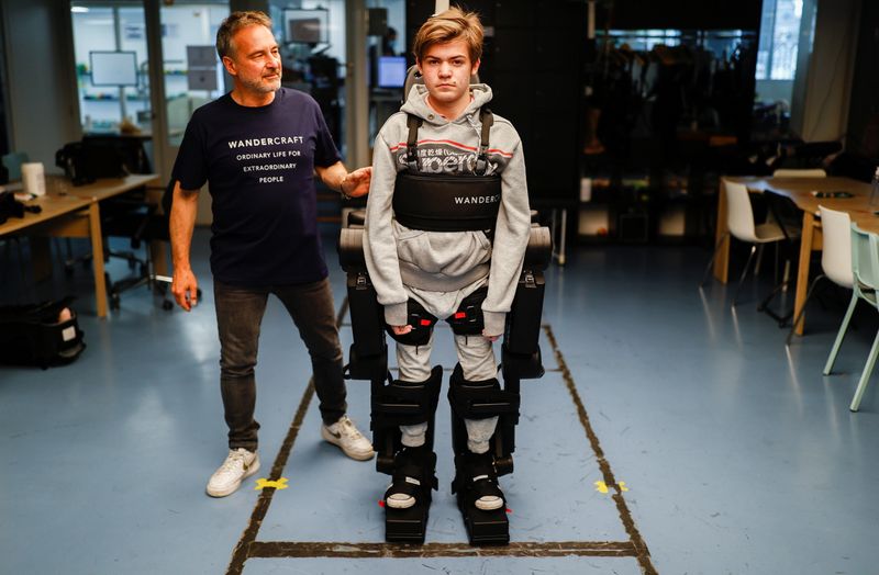 Robot exoskeleton helps wheelchair-bound get up and walk