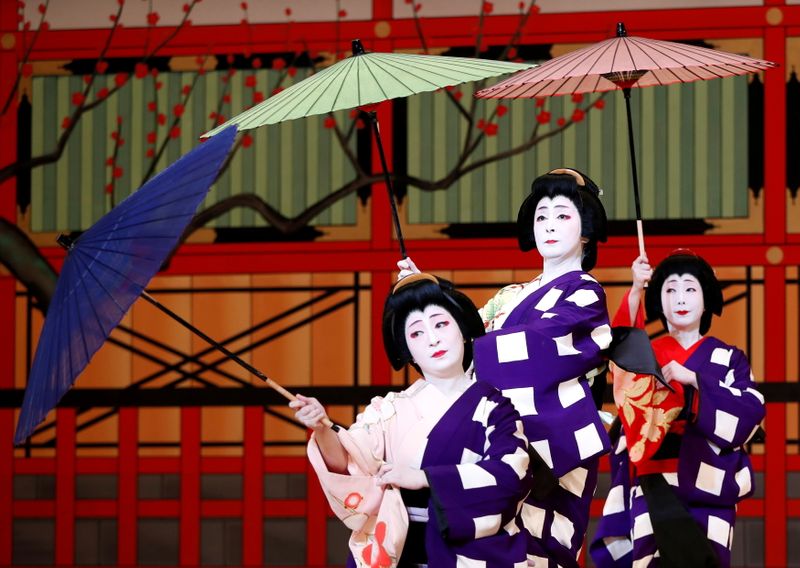 FILE PHOTO: Geishas, traditional Japanese female entertainers, perform their dance