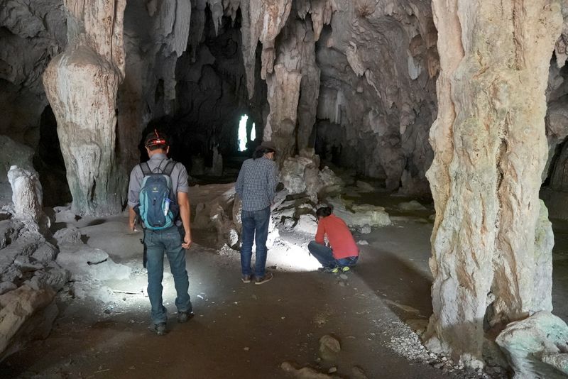 Archaelogists visit the Leang Panninge cave during a research for