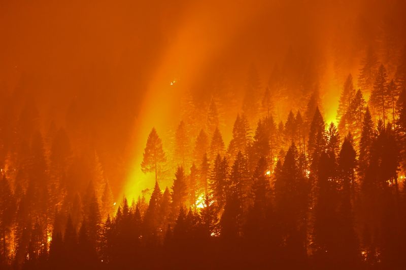 Dixie Fire, California’s largest active fire burns at night in
