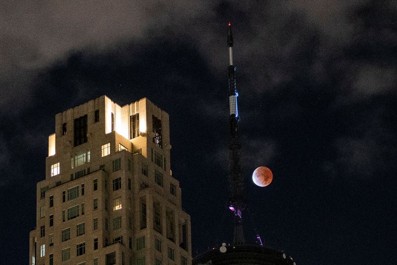The moon undergoes a partial lunar eclipse as seen from